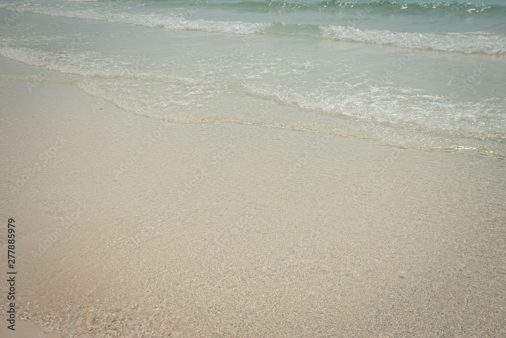droped sungrass and small waves lapped the beach