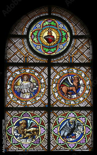 Symbols of the Evangelists, stained glass window in the parish church of St. Peter and Paul in Oberstaufen, Germany 