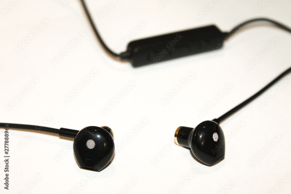 bluetooth headphones in hand on white background close on top bluetooth headphones in hand on white background close on top