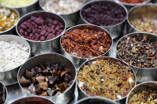 Different spices and herbs in metal bowls on a street market in Kolkata, India