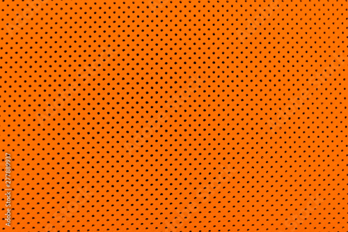 Luxury Car orange leather interior. Part of perforated leather car seat details. Brown Perforated leather texture background. Texture, artificial leather with stitching. Perforated leather seat
