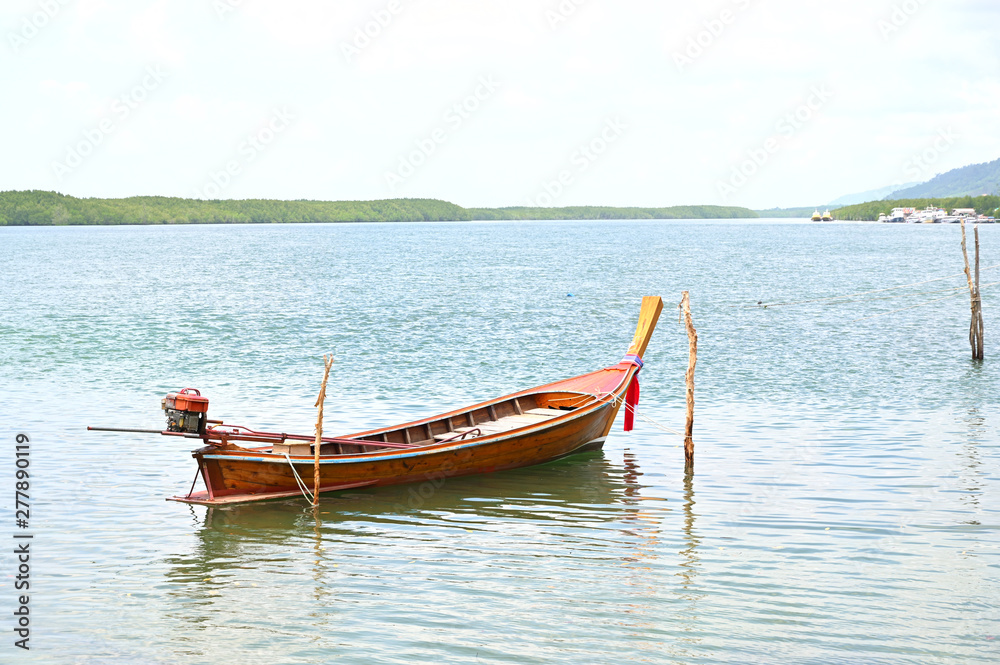Small wooden boat in the sea