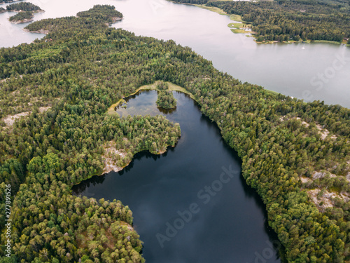 Aerial view of blue lakes and green forests on a sunny summer day in  Pentala island museum  Finland
