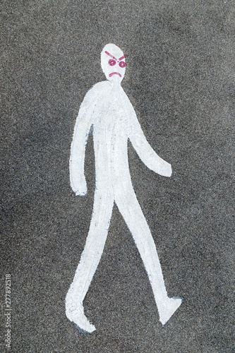 pedestrian crossing sign on asphalt