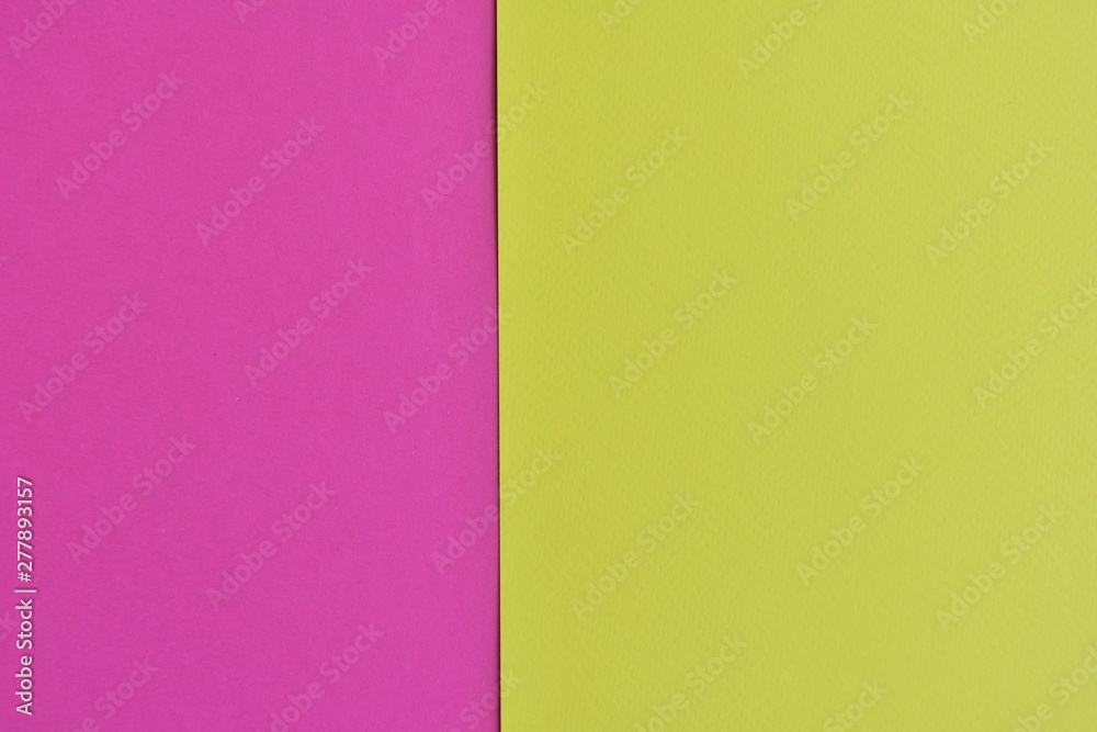 Two tone paper background with magenta and yellow color. Blank colorful backdrop with empty space for image or text. Mockup concept. Neon empty paper background. Clean yellow and pink wallpaper 