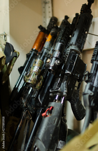 Handcrafted airsoft gun rack in the workshop worn with time