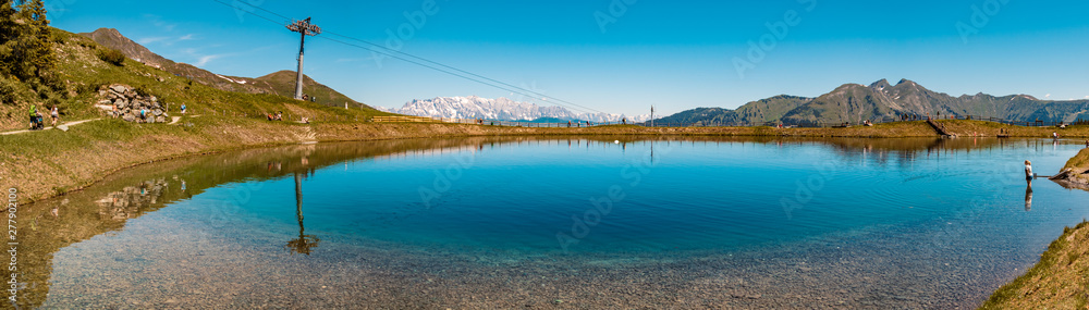 High resolution stitched panorama of a lake with reflections and a beautiful alpine view at Rauris, Salzburg, Austria