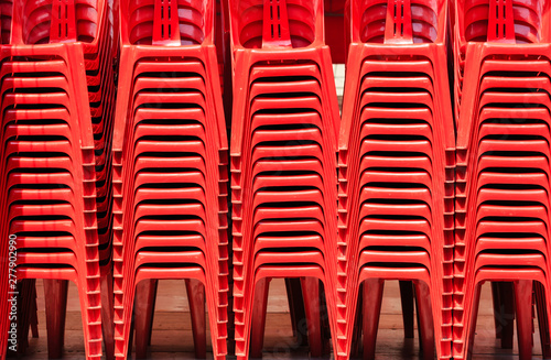 Render Of Stacked Red color Chairs background