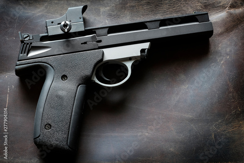 Handguns Pistols on Leather Background Weapons for Self Defense