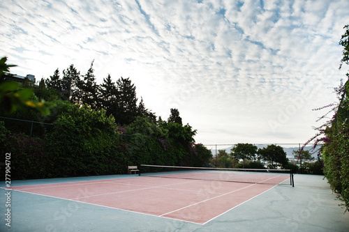 Wallpaper Mural Empty tennis court resort with cloudy sky. Torontodigital.ca