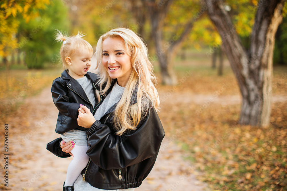 Close up portrait of beautiful mother with daughter.