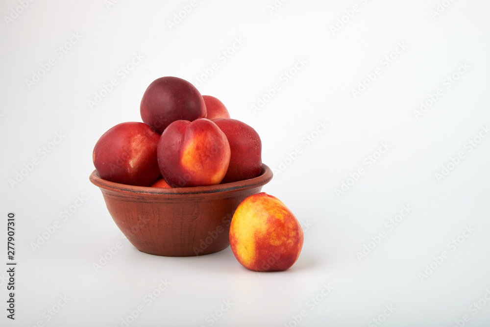 Ripe juicy nectarines isolated on white background Ripe juicy nectarines isolated on white background