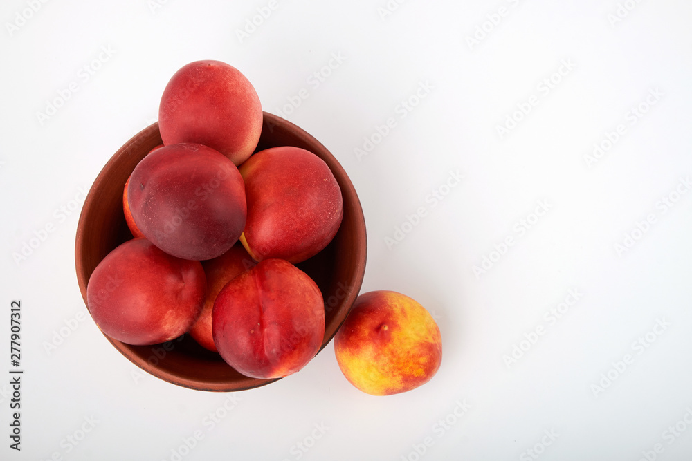 Ripe juicy nectarines isolated on white background Ripe juicy nectarines isolated on white background
