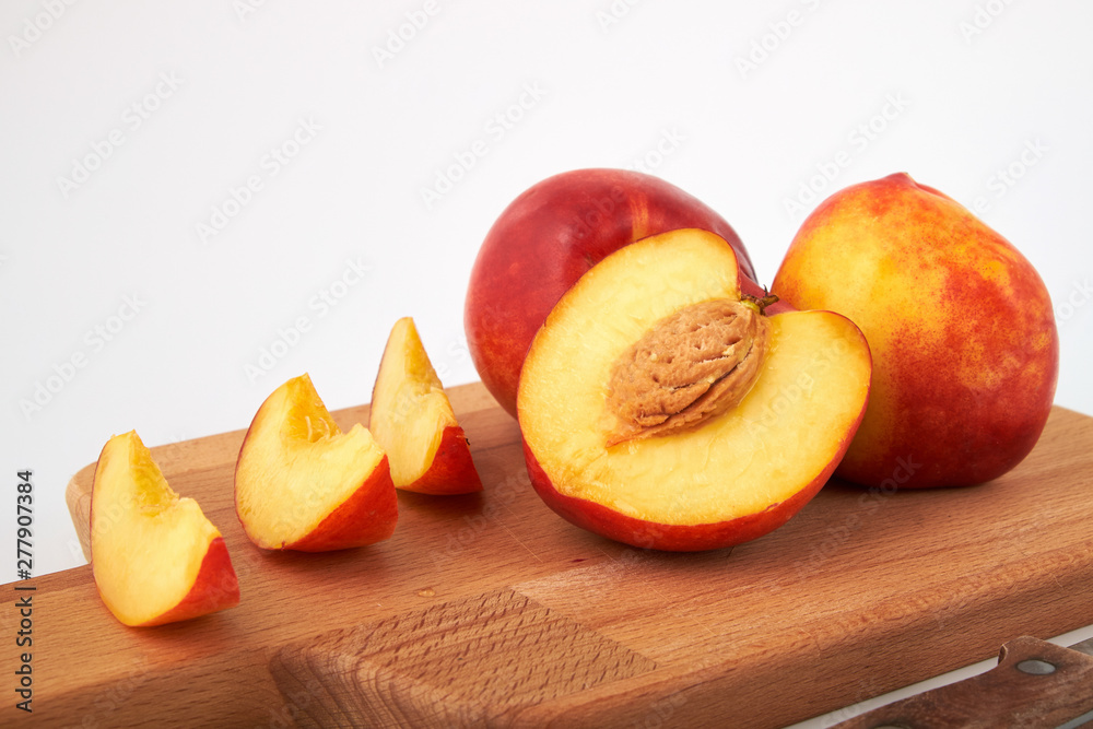 Ripe juicy nectarines isolated on white background Ripe juicy nectarines isolated on white background