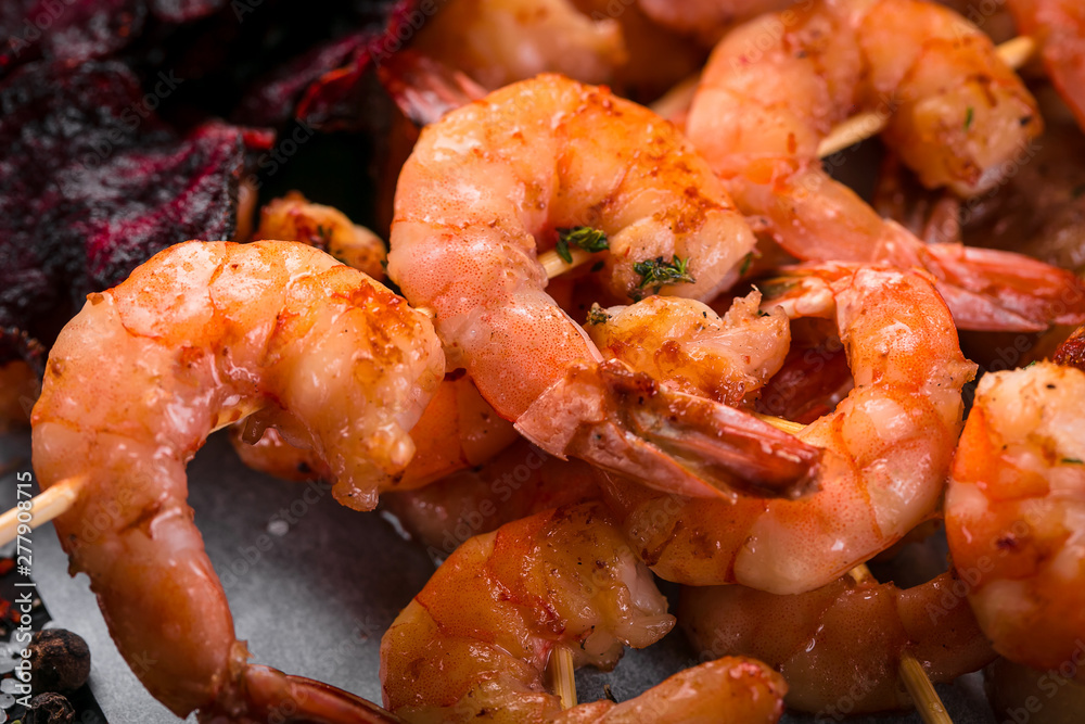 grilled shrimp skewers on a dark background grilled shrimp skewers on a dark background