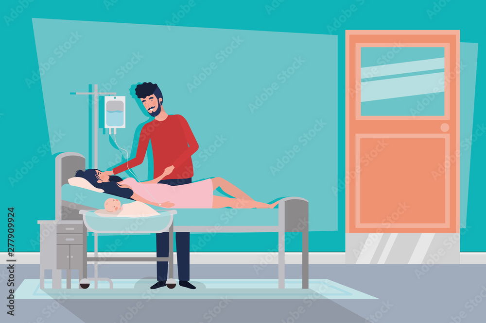 parents couple with newborn baby in hospital room parents couple with newborn baby in hospital room