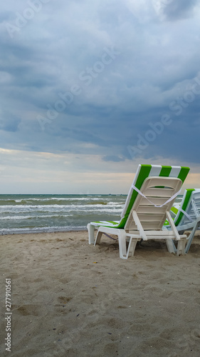 two chairs on the beach. Summer sea sunset landscape. 