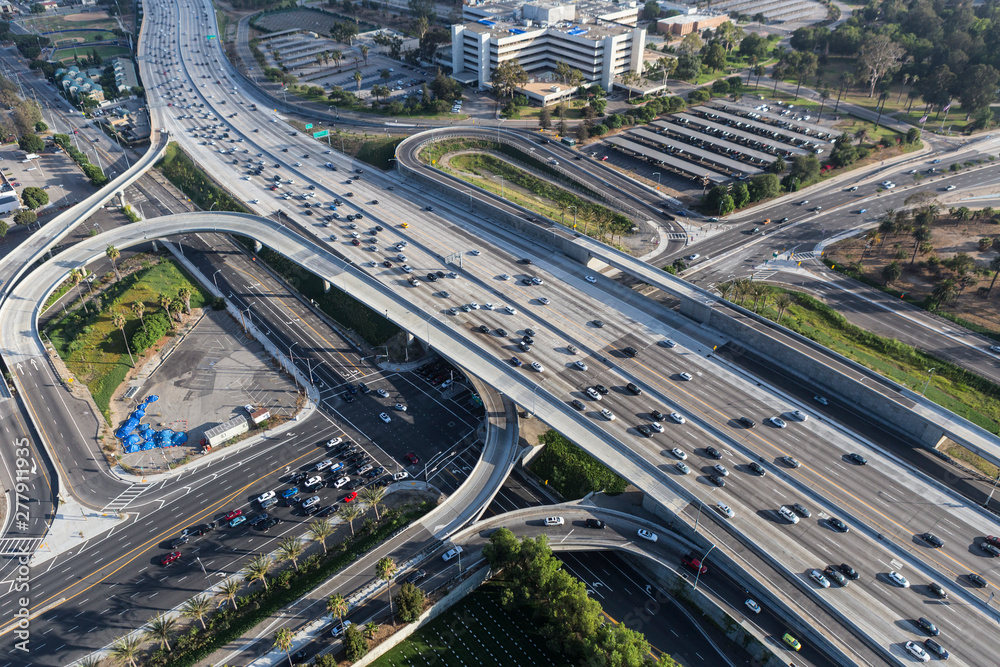 Aerial view of cars, ramps and buildings near the San Diego 405 Freeway at Wilshire Bl in Los Angeles, California.  