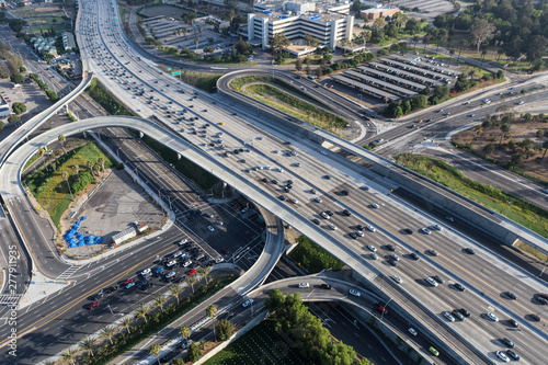 Aerial view of cars, ramps and buildings near the San Diego 405 Freeway at Wilshire Bl in Los Angeles, California. 