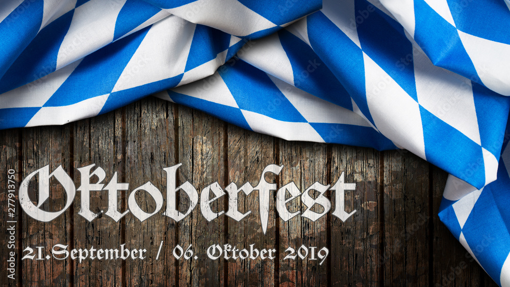 Oktoberfest 2019 Banner mit bayrischem Tischtuch auf Holzhintergrund - obrazy, fototapety, plakaty 