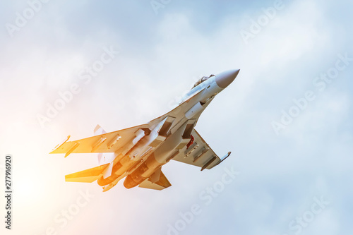 Obraz na płótnie Rapidly taking off combat fighter in the air.