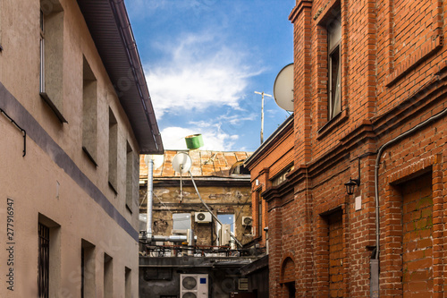 ir conditioners on a brick wall. Inner courtyard of the quarter built in the nineteenth century. Site about building, architecture, ventilation. photo