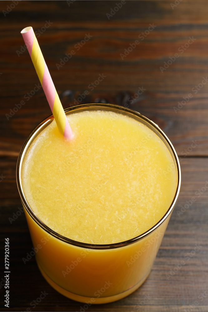 Orange juice and soda (schorle) in a tumbler glass