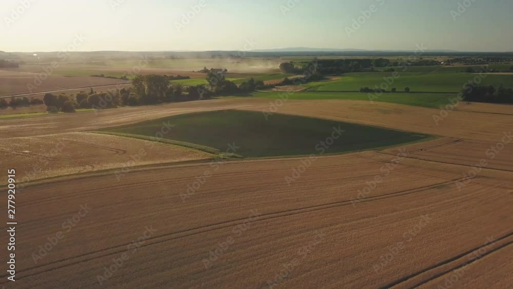 Aerial view over wheat field with beautiful hill landscape Germany in 4k