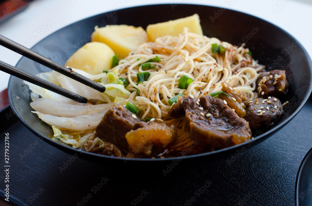 Closeup of a bowl of beef and vegetable stir fry. Closeup of a bowl of beef and vegetable stir fry.