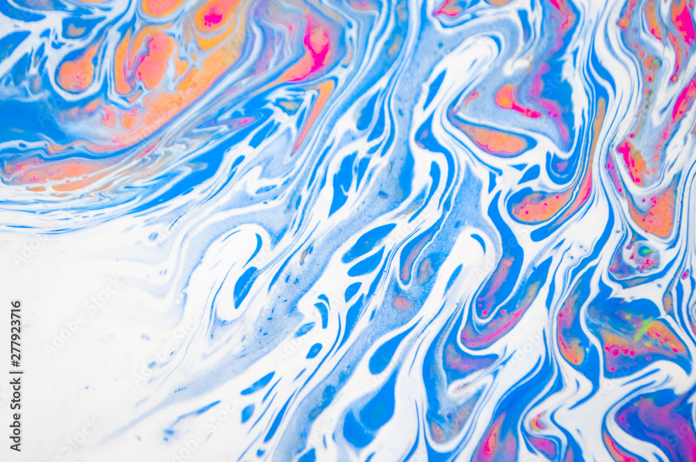 Abstract colorful painting background made in fluid art technique. Trendy pattern.