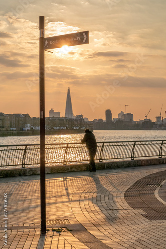 silhouette of a person watching the sunset