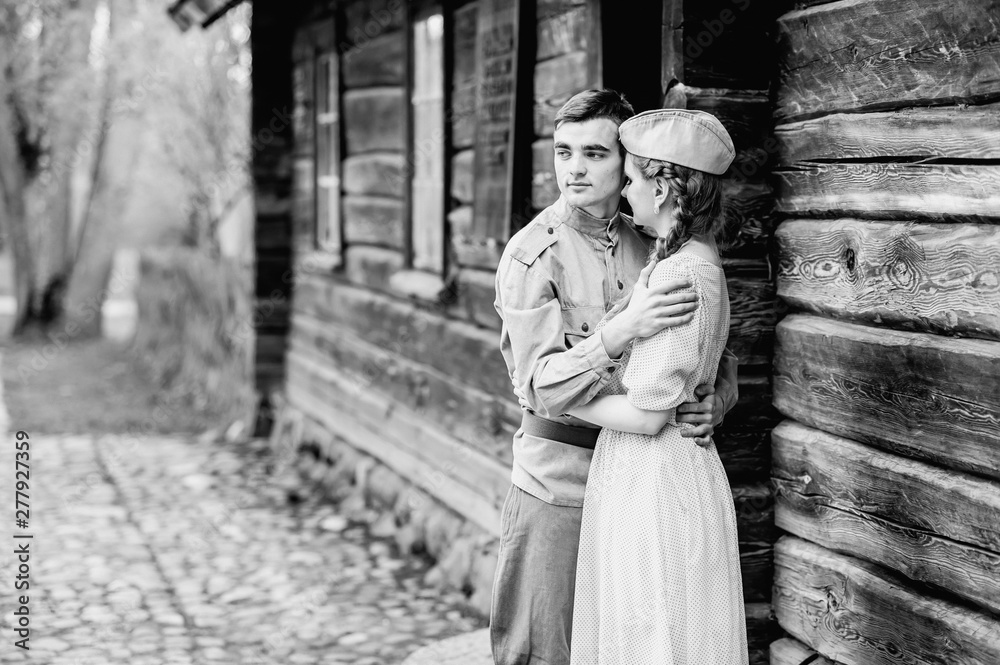 Husband hugs wife in the army Black and White