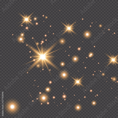 Set of gold glowing light effects isolated on dark background. Glow light effect. Star exploded sparkles.