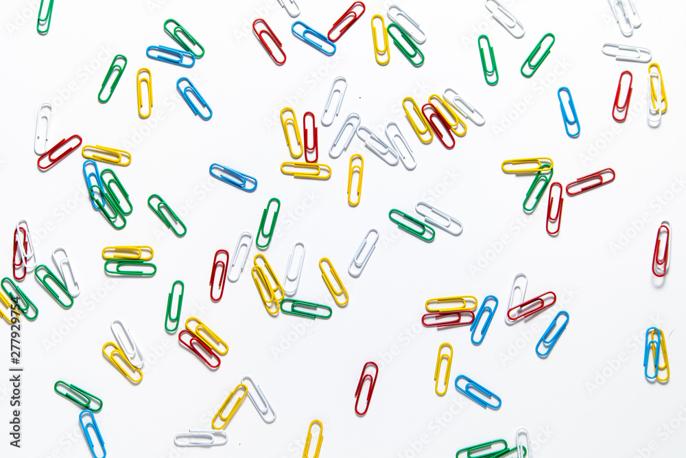 colored paper clips on a white background colored paper clips on a white background