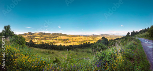 Colorful landscape valley with mountains in the background photo