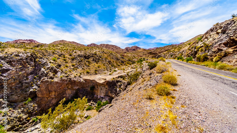 Obraz premium Colorful and Rugged Mountains and Ravines in El Dorado Canyon on the border of Nevada and Arizona. The canyon is part of the Lake Mead National Recreation Area in the USA
