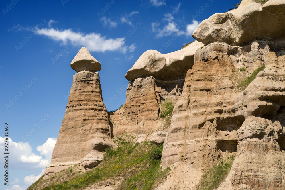 Amazing sandstone formations in Cappadocia, Turkey. View in sunny weather.