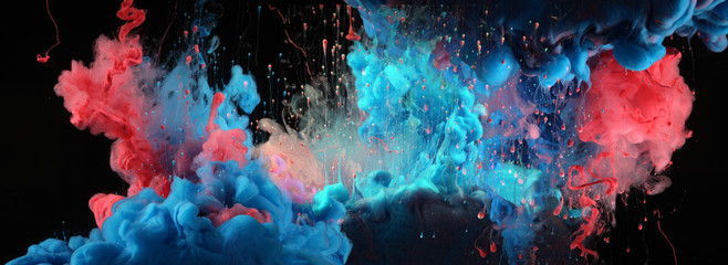 Acrylic blue and red colors in water. Ink blot. Abstract black background.
