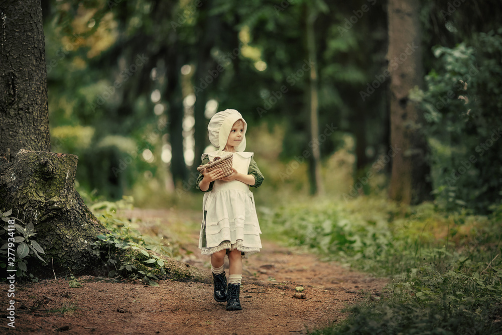 Magic childhood. Miracles happen. A little fairy girl walks through an incredibly beautiful green forest. Bedtime Stories.