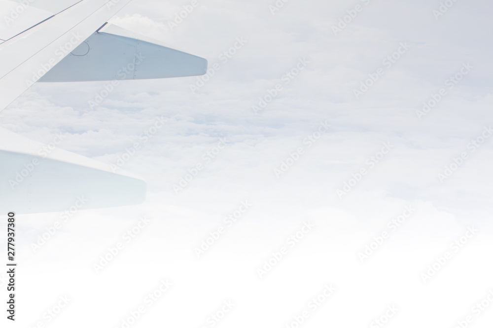 Wing of aircraft is flying. Sky background,bright daylight. Wing of aircraft is flying. Sky background,bright daylight.