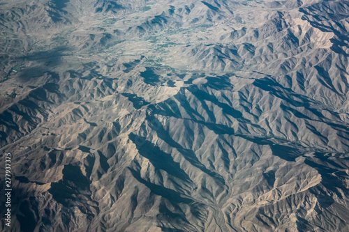Aerial views in Tibet fly over to mountain Himalaya. Top view of the mountains Himalayas