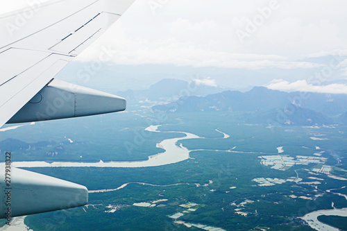 High angle view on plane Thailand At daytime,view from the plane window mountains and sea near Phuket Island.