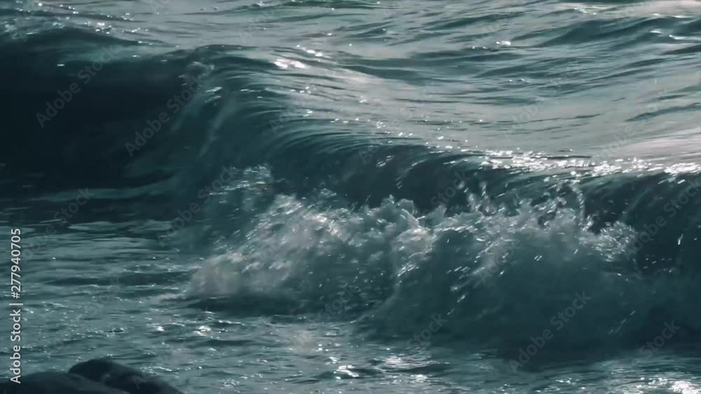 Close up shot of sea waves, aqua foam. Waves crashing powerful and ocean water splashing. Close up shot of sea waves, aqua foam. Waves crashing powerful and ocean water splashing.