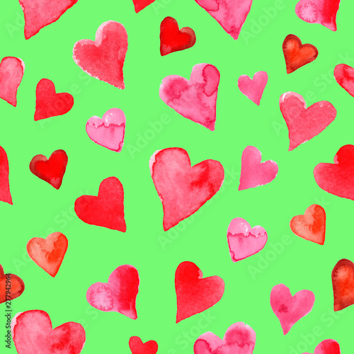 Seamless pattern with watercolor hearts on a green background. Hand drawn illustration. Paper and fabric design