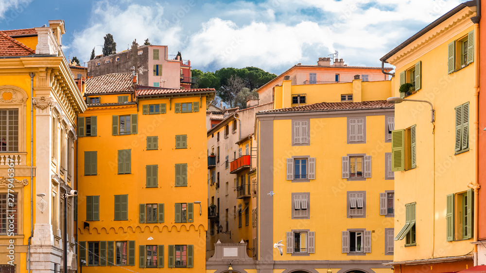 Obraz premium Nice in France, building yard with typical colorful facades in the old town, French Riviera 
