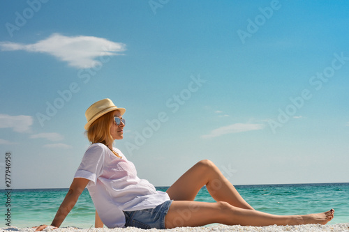Beautiful woman on tropical beach
