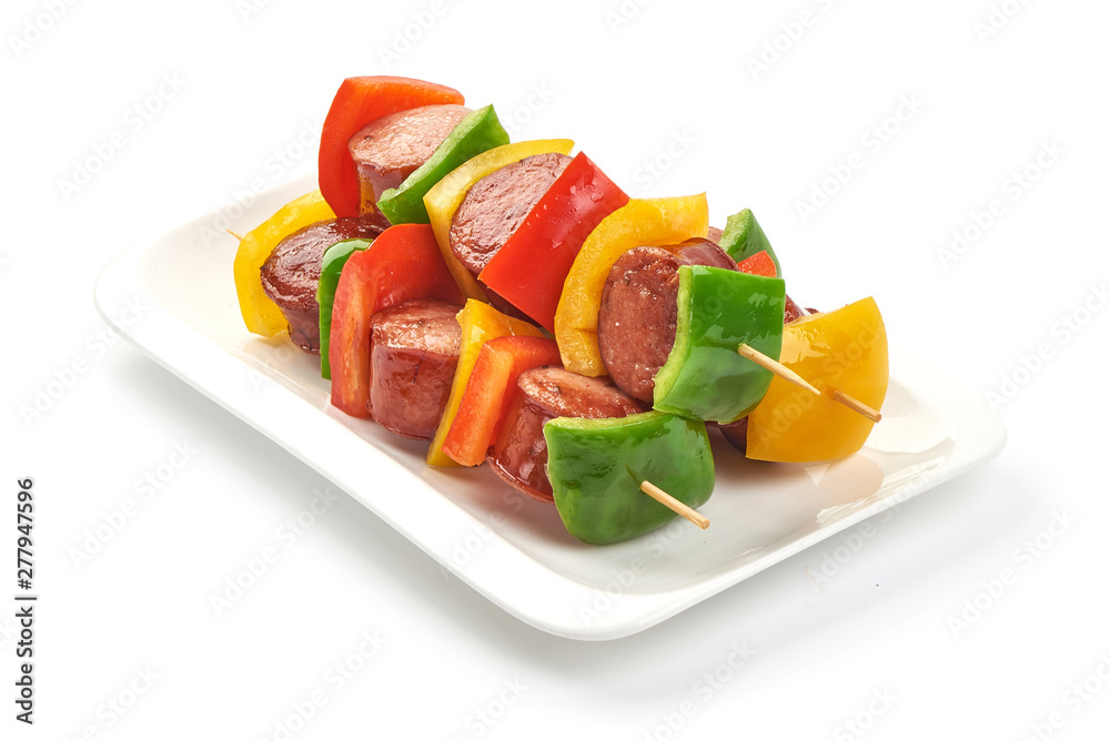 Shish Kebab - grilled pork bratwurst sausage skewers and vegetables BBQ, close-up, isolated on white background Shish Kebab - grilled pork bratwurst sausage skewers and vegetables BBQ, close-up, isolated on white background