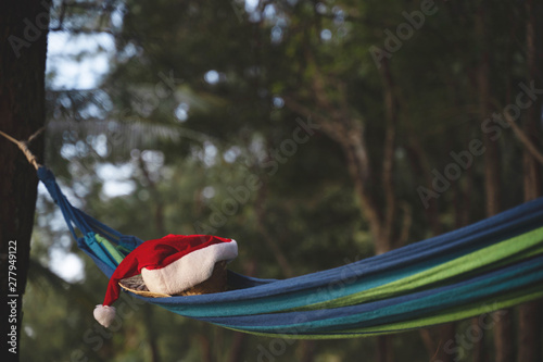 Christmas Santa hat and hammock on the beach. are texture Nature background creative tropical layout made at phuket Thailand