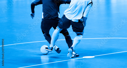 Football Futsal Ball and man Team. Indoor Soccer Sports Hall. photo