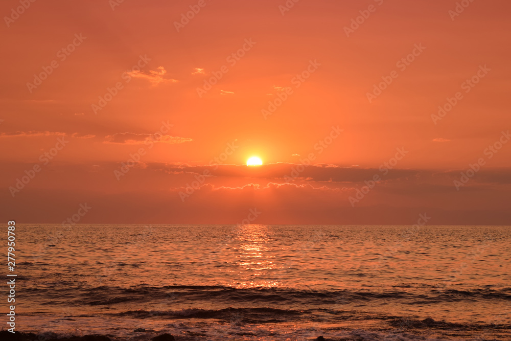 warm , red sunset on the sea